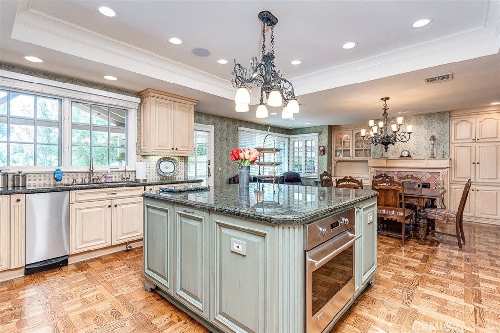 Chandelier, Dining room, Interior, Kitchen, Recessed Lighting, Stainless Steel Appliances, Wood Texture Flooring