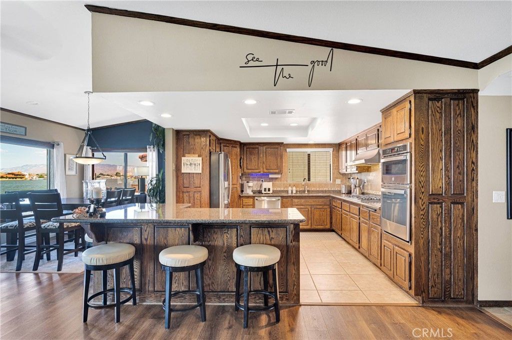 Dining room, Interior, Kitchen, Pendant Lights, Recessed Lighting, Stainless Steel Appliances, Wood Texture Flooring