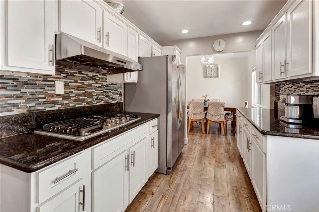 Dining room, Interior, Kitchen, Recessed Lighting, Stainless Steel Appliances, Wood Texture Flooring