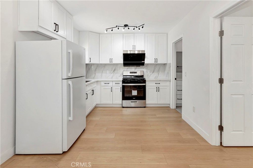 Interior, Kitchen, Marble Walls, Stainless Steel Appliances, Wood Texture Flooring