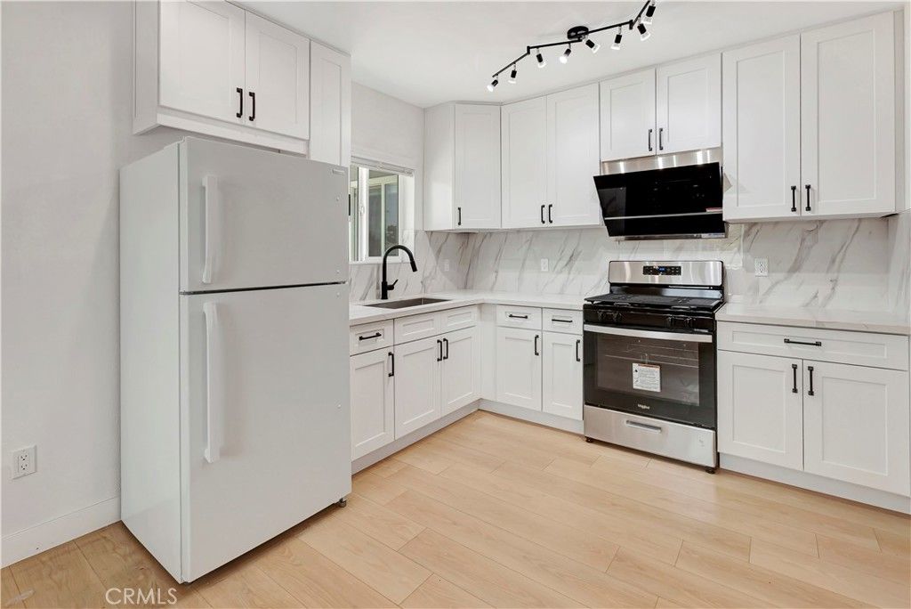 Interior, Kitchen, Marble Walls, Stainless Steel Appliances, Wood Texture Flooring