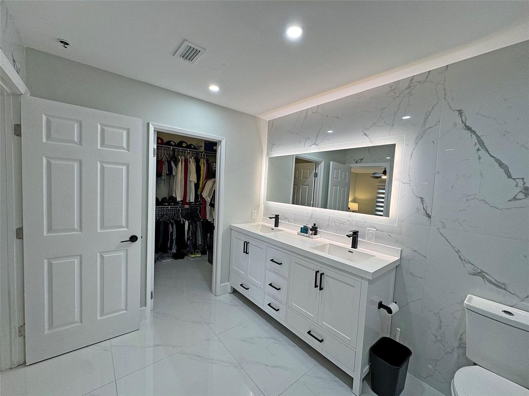 Bathroom, Dual Sink Vanities, Interior, Marble, Marble Walls, Recessed Lighting