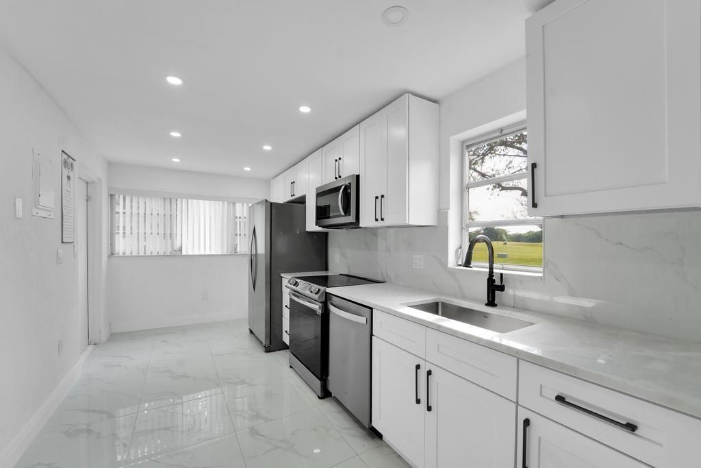 Interior, Kitchen, Marble, Marble Walls, Recessed Lighting, Stainless Steel Appliances