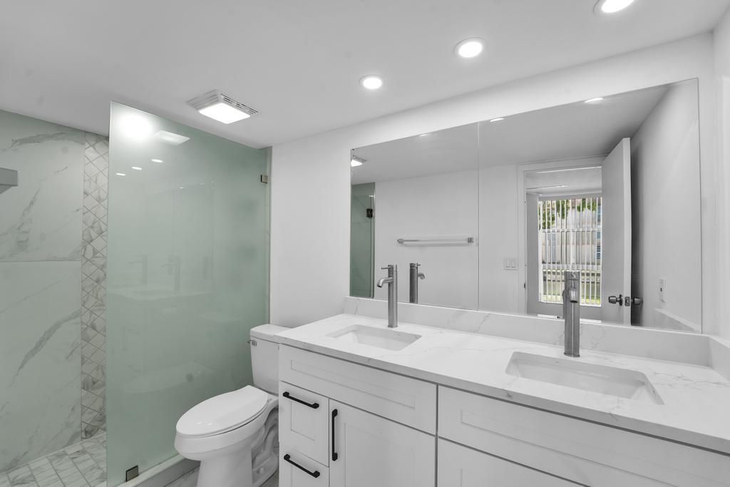 Bathroom, Dual Sink Vanities, Glass Shower, Interior, Marble, Marble Walls, Recessed Lighting