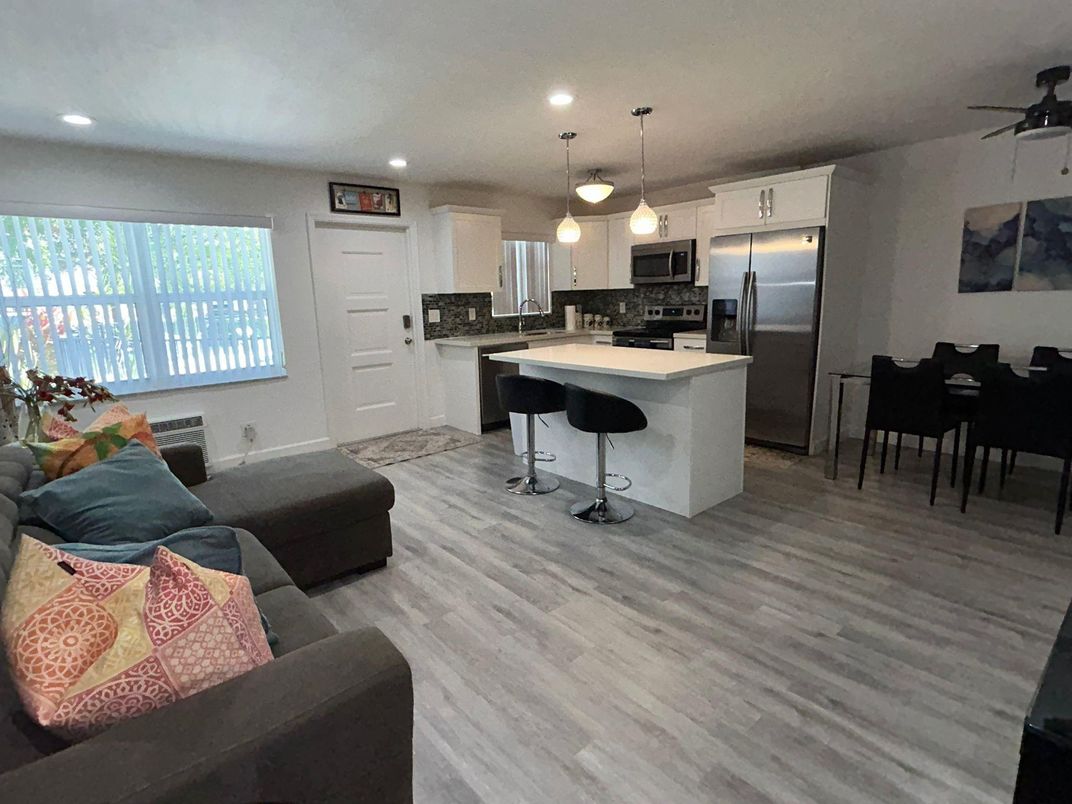 Dining room, Interior, Kitchen, Living room, Pendant Lights, Recessed Lighting, Stainless Steel Appliances, Wood Texture Flooring