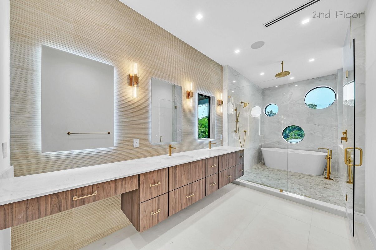 Bathroom, Dual Sink Vanities, Free Standing Baths, Glass Shower, Interior, Marble Walls, Recessed Lighting