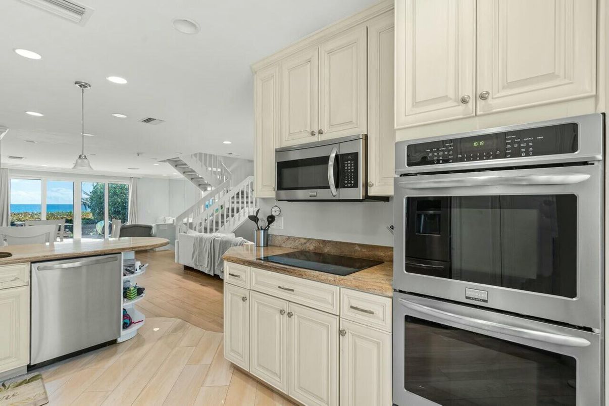 Dining room, Interior, Kitchen, Pendant Lights, Recessed Lighting, Stainless Steel Appliances, Water, Wood Texture Flooring