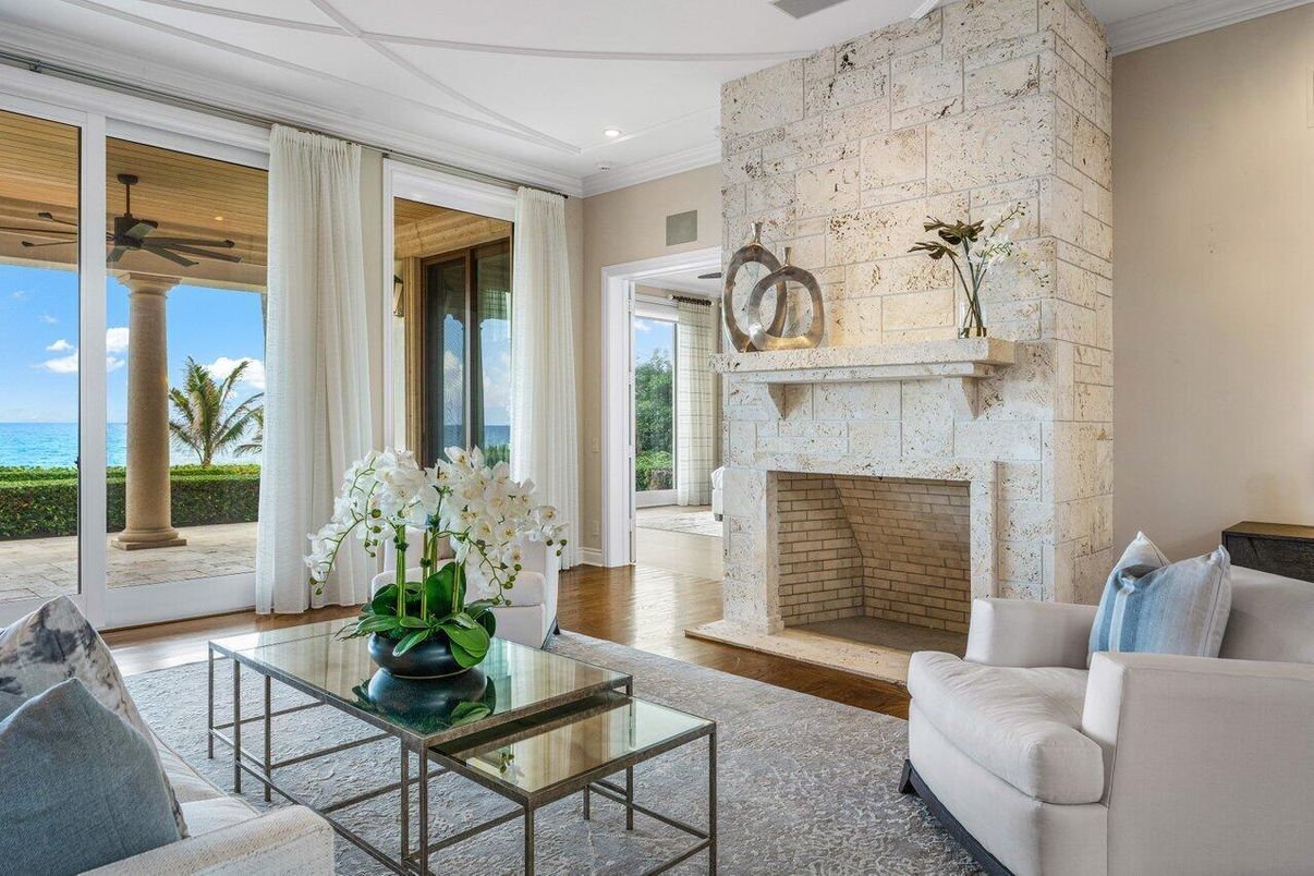 Fireplace, Interior, Living room, Recessed Lighting, Stone Walls, Water, Wood Texture Flooring