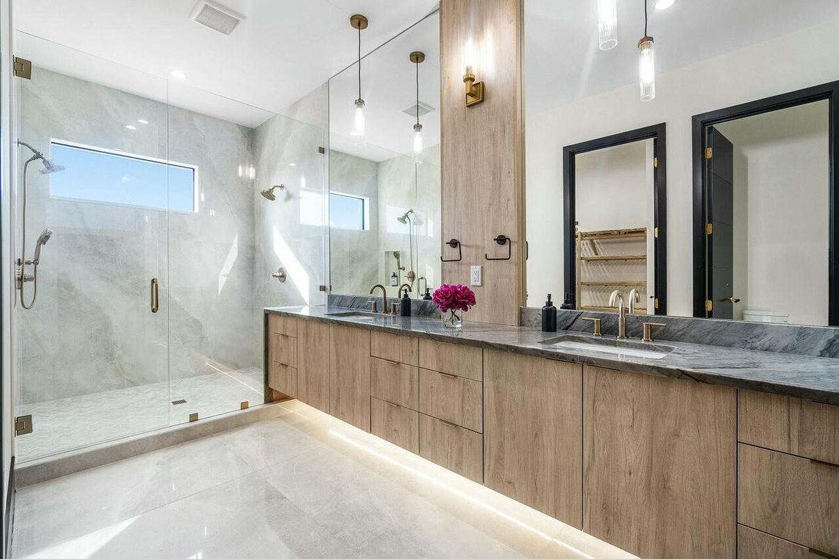 Bathroom, Dual Sink Vanities, Glass Shower, Interior, Marble Walls, Pendant Lights, Recessed Lighting