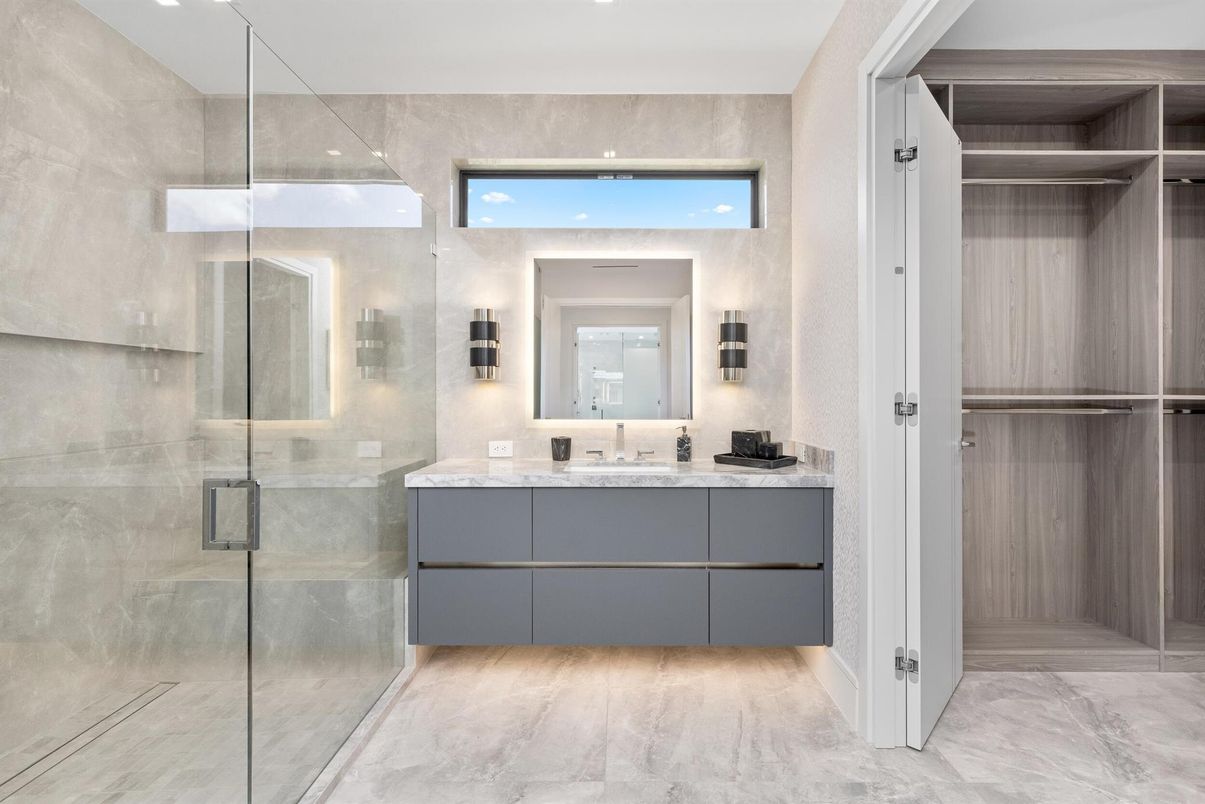 Bathroom, Dual Sink Vanities, Glass Shower, Interior, Marble, Recessed Lighting, Walk-in Closets