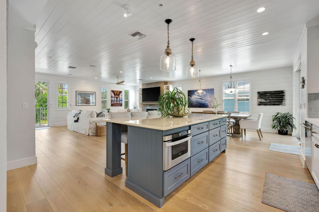 Dining room, Interior, Kitchen, Living room, Pendant Lights, Recessed Lighting, Stainless Steel Appliances, Water, Wood Texture Flooring