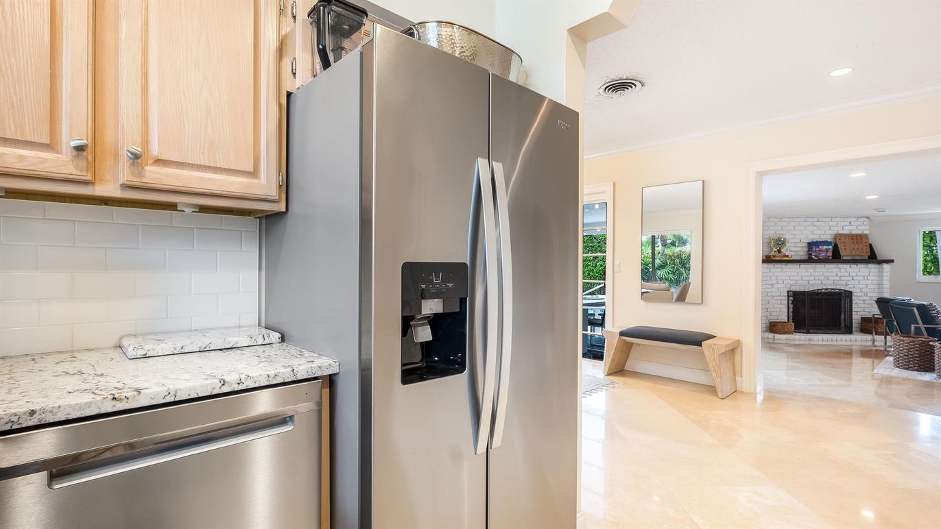 Fireplace, Interior, Kitchen, Recessed Lighting, Stainless Steel Appliances, Stone Walls