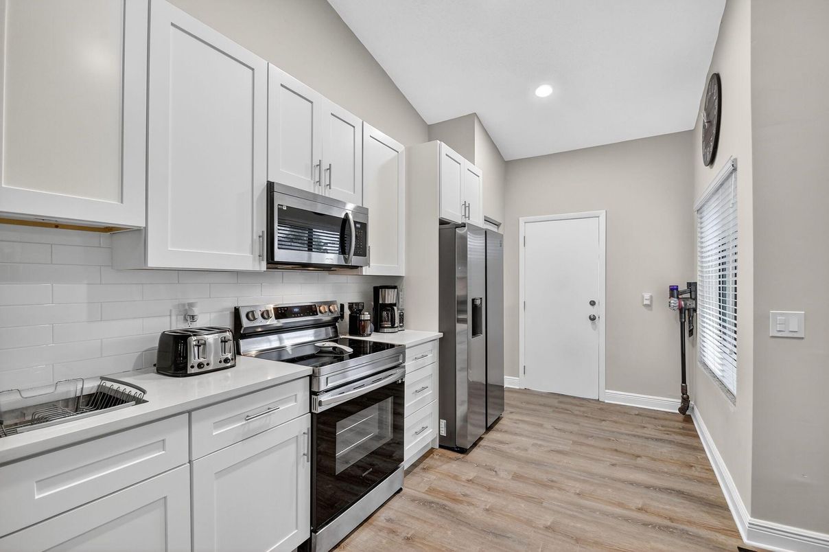 Interior, Kitchen, Recessed Lighting, Stainless Steel Appliances, Wood Texture Flooring