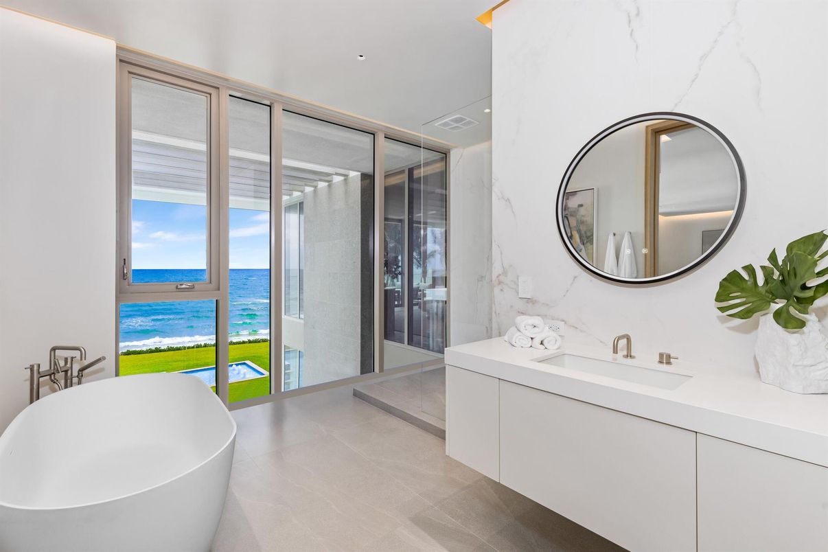 Bathroom, Dual Sink Vanities, Free Standing Baths, Glass Shower, Interior, Marble Walls, Recessed Lighting, Water