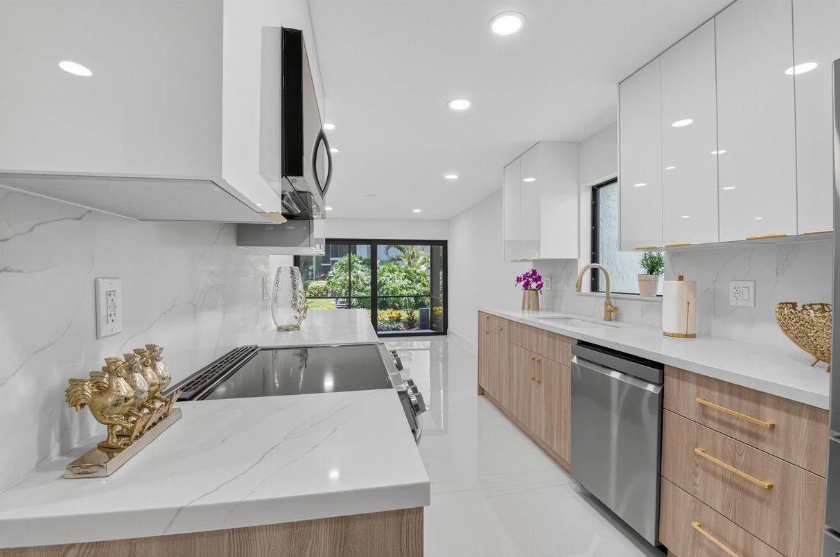 Interior, Kitchen, Marble Walls, Recessed Lighting, Stainless Steel Appliances
