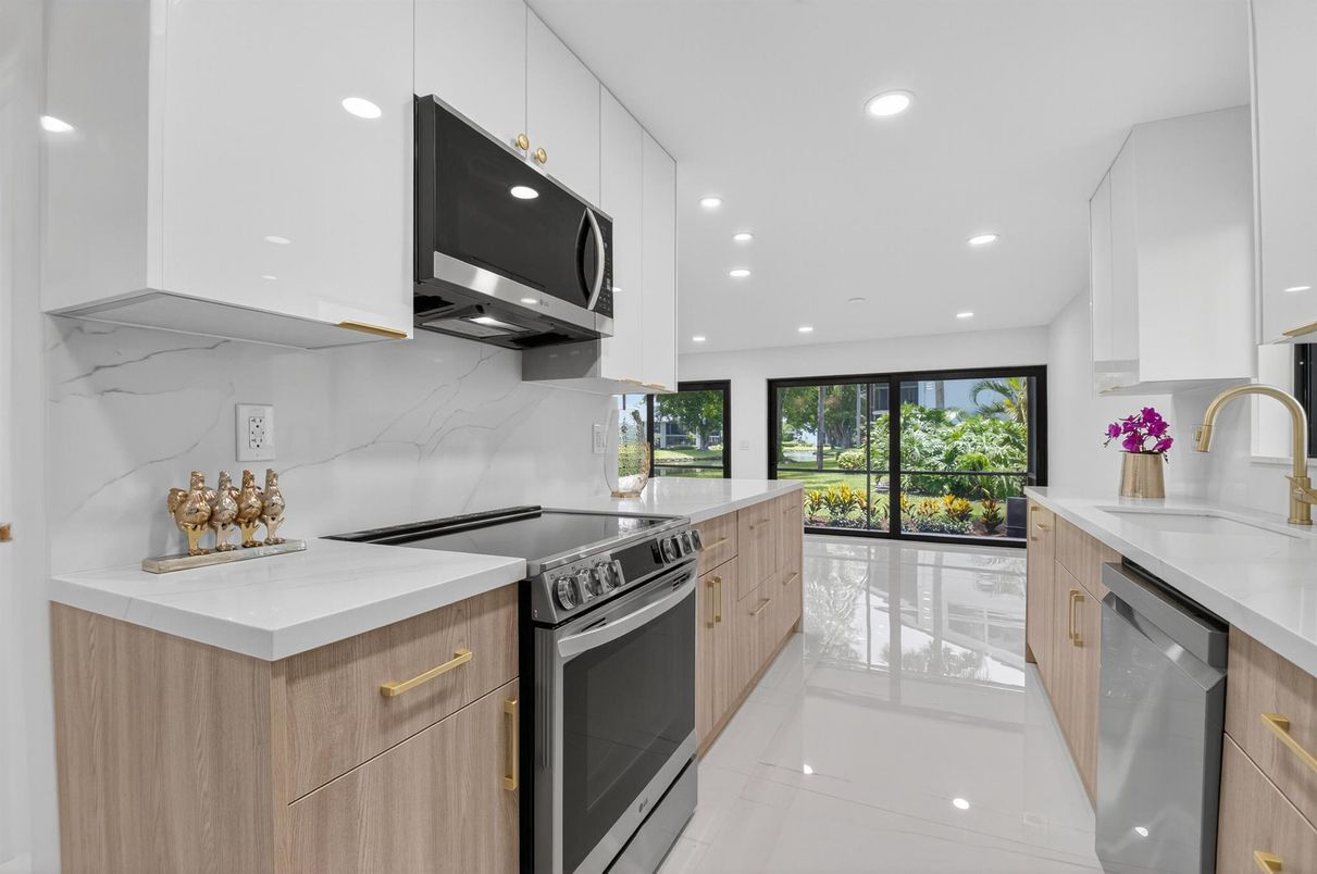 Interior, Kitchen, Marble Walls, Recessed Lighting, Stainless Steel Appliances