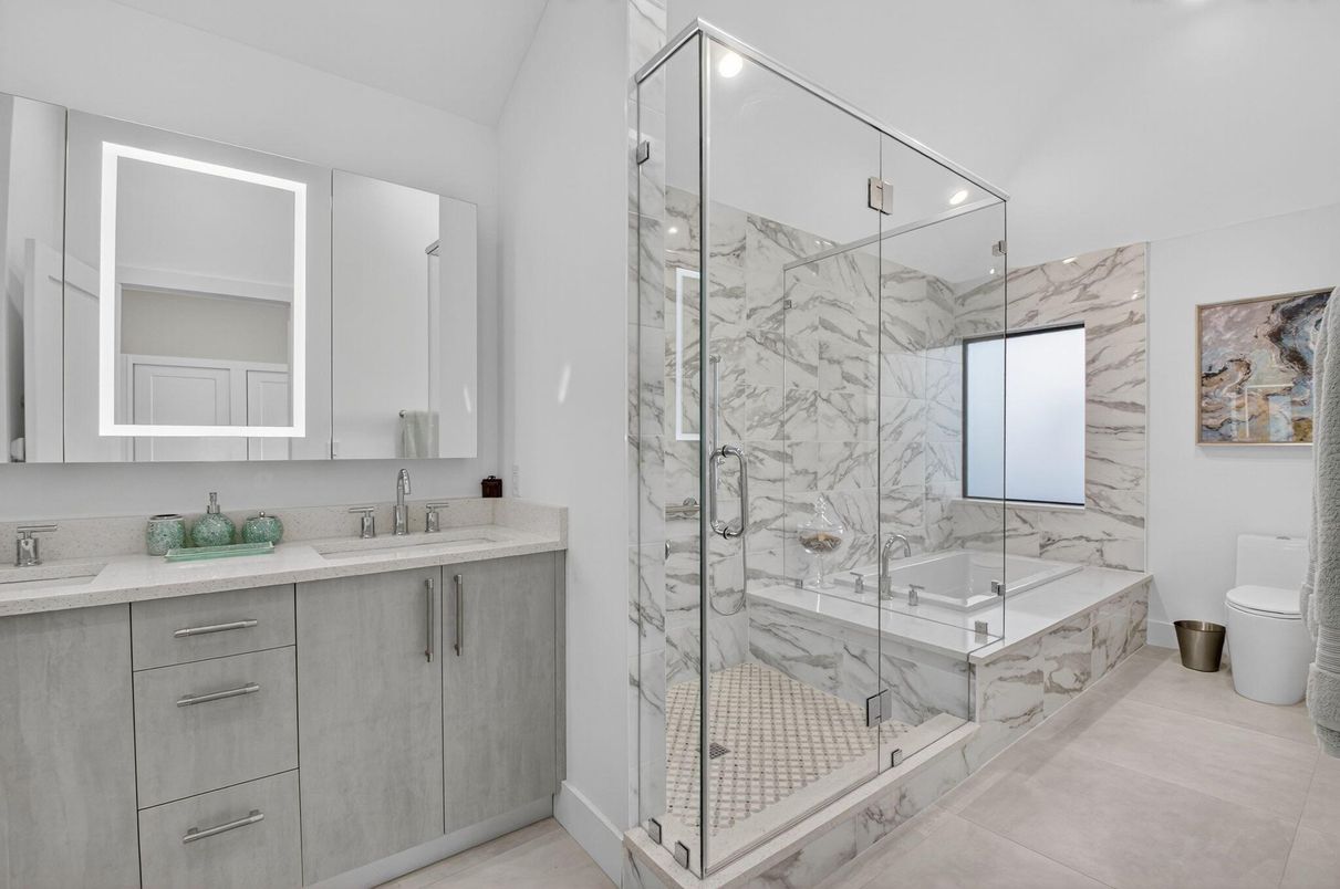 Bathroom, Dual Sink Vanities, Glass Shower, Interior, Marble Walls, Recessed Lighting