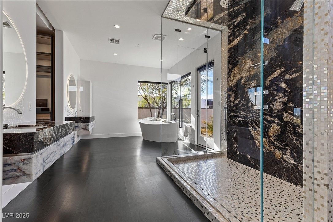 Bathroom, Free Standing Baths, Glass Shower, Interior, Marble Walls, Recessed Lighting, Wood Texture Flooring