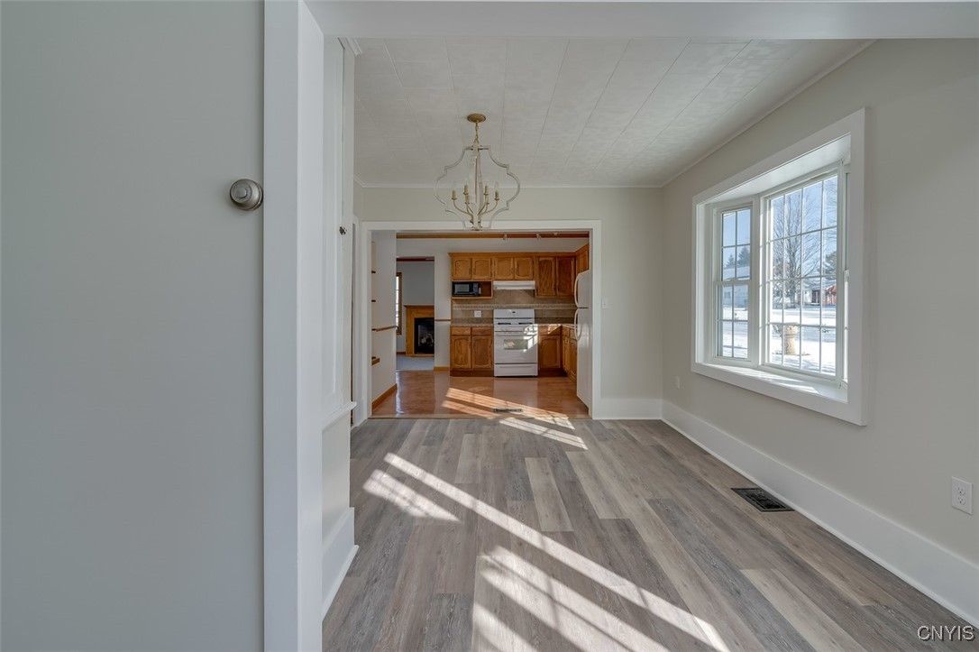 Chandelier, Empty room, Interior, Kitchen, Pendant Lights, Stainless Steel Appliances, Wood Texture Flooring