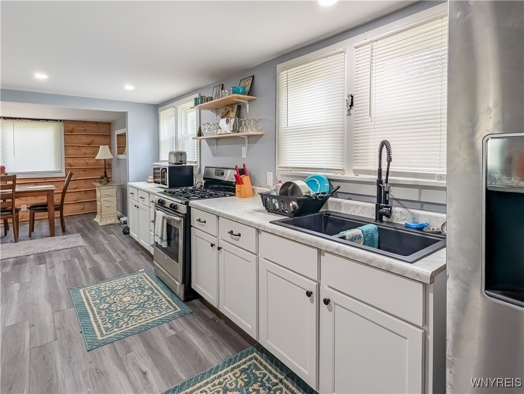 Dining room, Interior, Kitchen, Recessed Lighting, Stainless Steel Appliances, Wood Texture Flooring