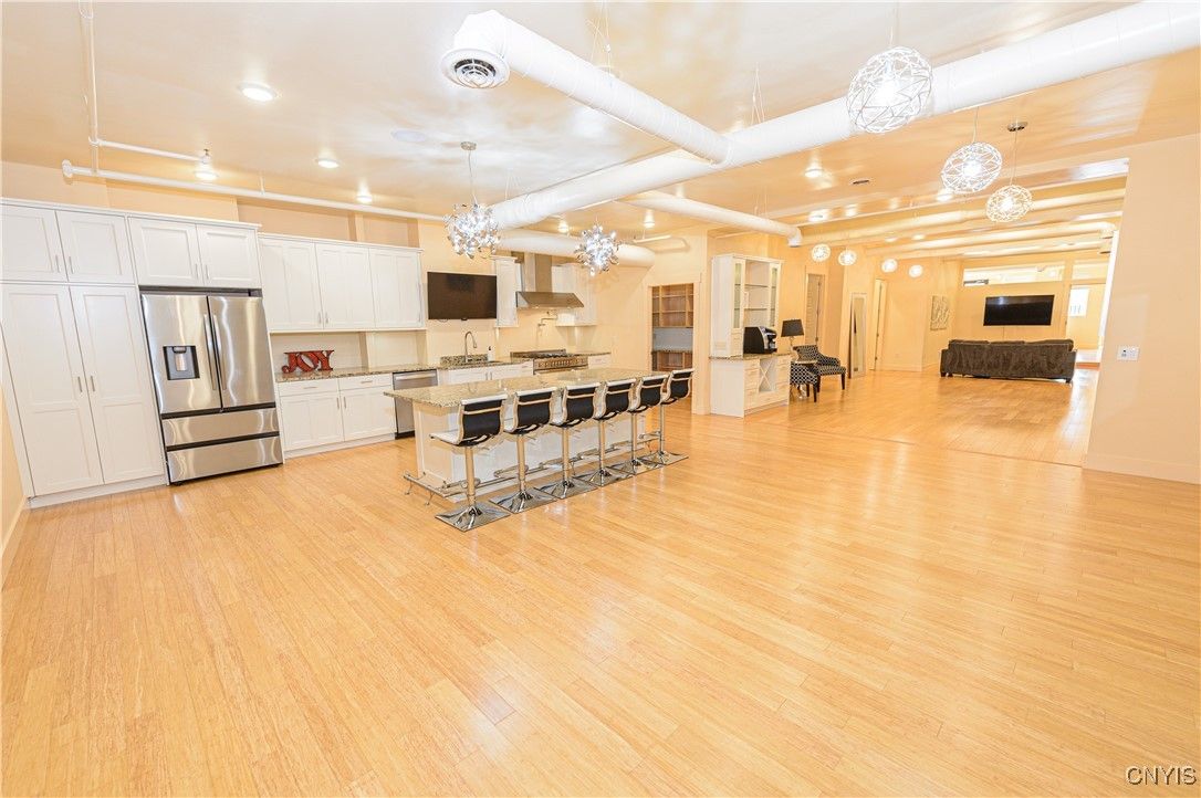 Chandelier, Interior, Kitchen, Pendant Lights, Recessed Lighting, Stainless Steel Appliances, Wood Texture Flooring