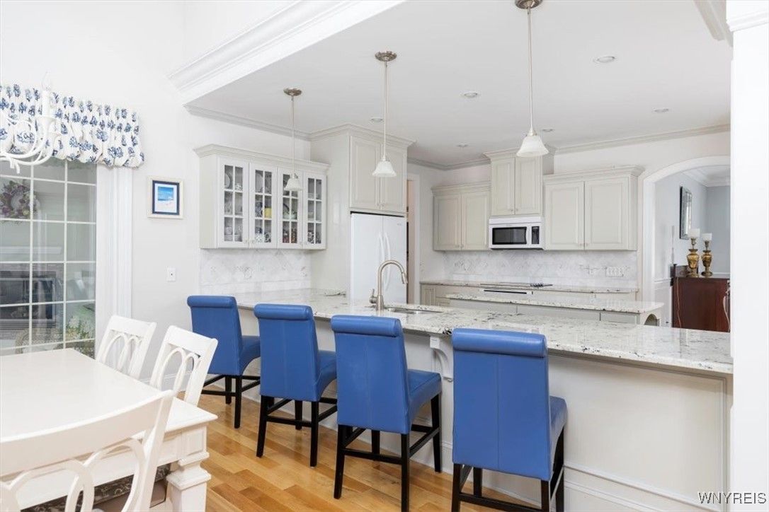 Dining room, Interior, Kitchen, Pendant Lights, Recessed Lighting, Stainless Steel Appliances, Wood Texture Flooring