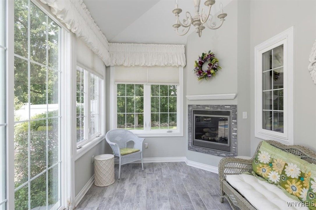 Chandelier, Fireplace, Interior, Sun Room, Wood Texture Flooring