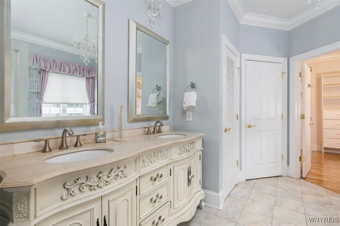 Bathroom, Chandelier, Dual Sink Vanities, Interior, Wood Texture Flooring