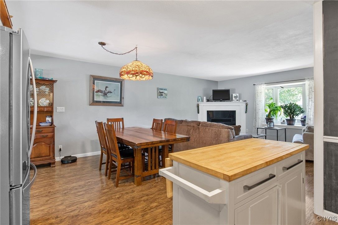 Dining room, Fireplace, Interior, Kitchen, Pendant Lights, Wood Texture Flooring