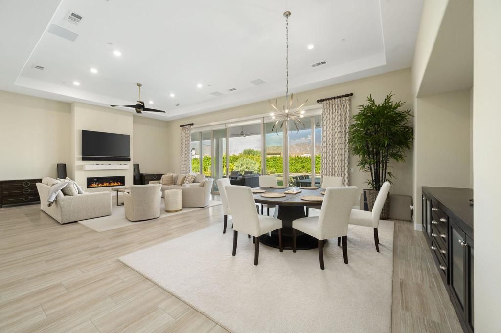 Dining room, Fireplace, Interior, Living room, Pendant Lights, Recessed Lighting, Wood Texture Flooring