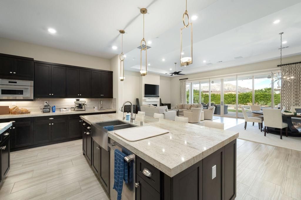 Chandelier, Dining room, Interior, Kitchen, Living room, Pendant Lights, Recessed Lighting, Stainless Steel Appliances, Wood Texture Flooring