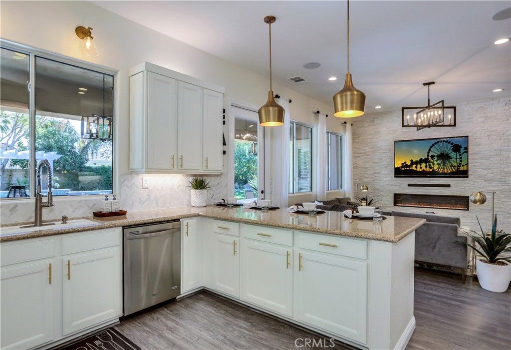 Fireplace, Interior, Kitchen, Pendant Lights, Recessed Lighting, Stainless Steel Appliances, Stone Walls, Wood Texture Flooring
