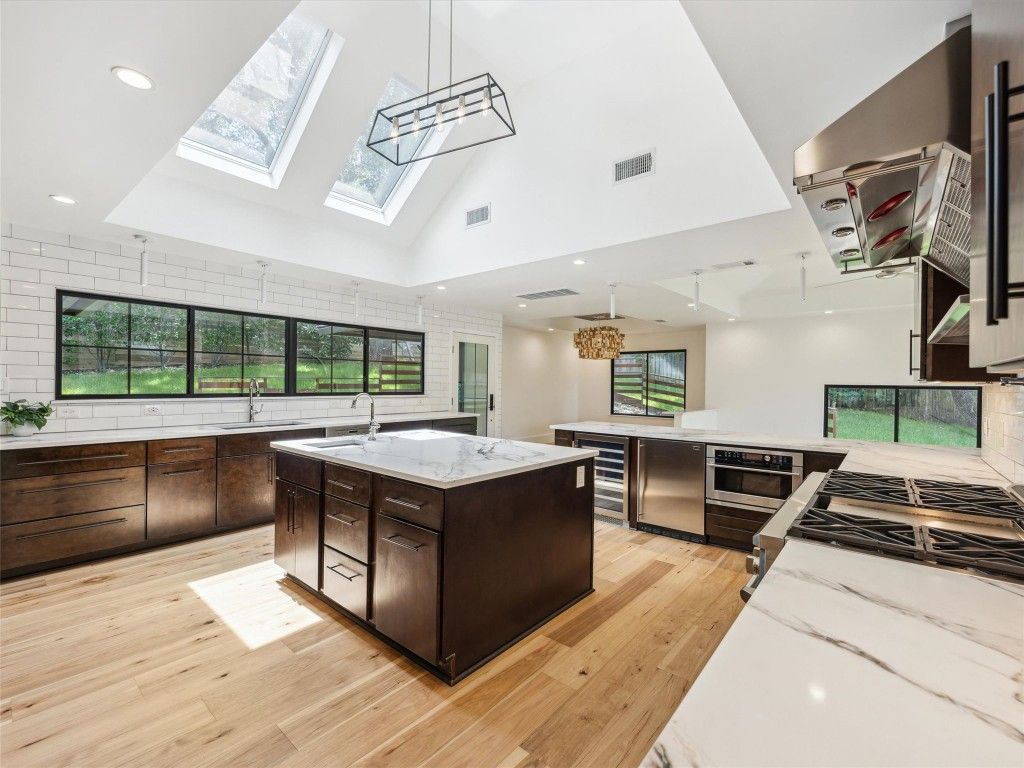 Glass Ceilings, Interior, Kitchen, Pendant Lights, Recessed Lighting, Stainless Steel Appliances, Wood Texture Flooring