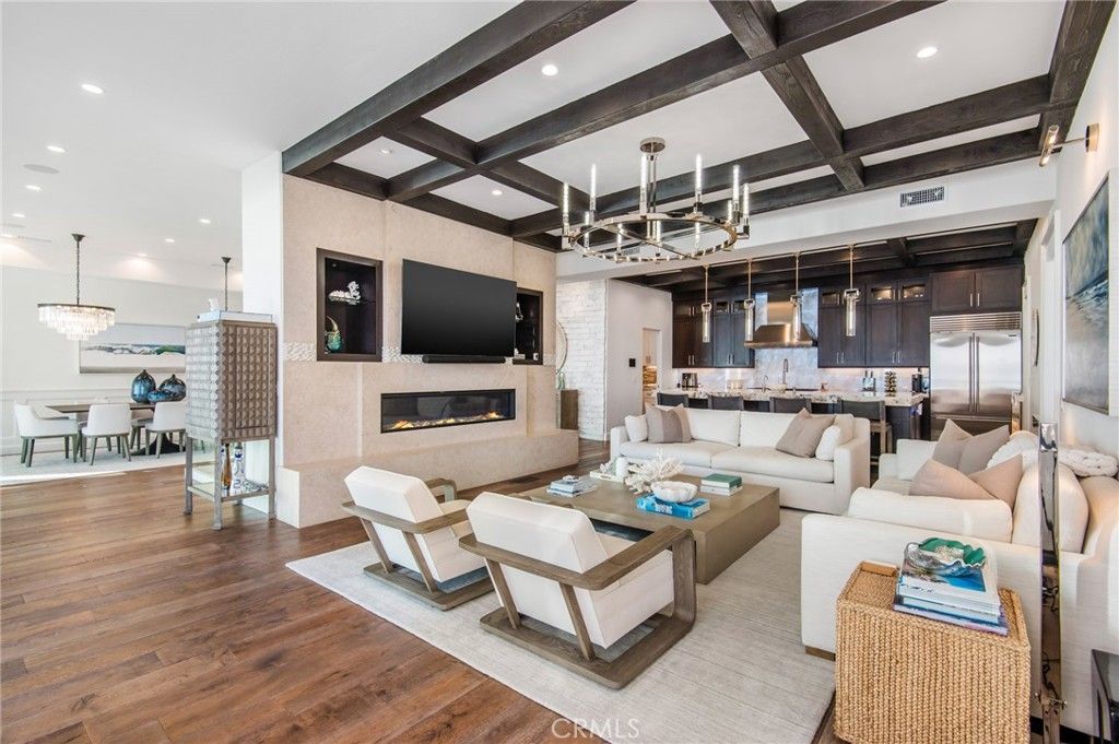 Chandelier, Dining room, Fireplace, Interior, Kitchen, Living room, Pendant Lights, Recessed Lighting, Stainless Steel Appliances, Wooden Beams, Wood Texture Flooring
