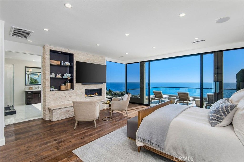 Bedroom, Fireplace, Interior, Living room, Recessed Lighting, Water, Wood Texture Flooring