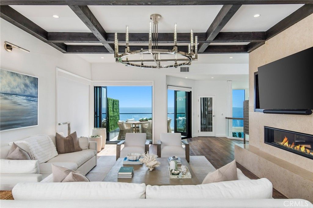 Chandelier, Fireplace, Interior, Living room, Recessed Lighting, Water, Wooden Beams, Wood Texture Flooring