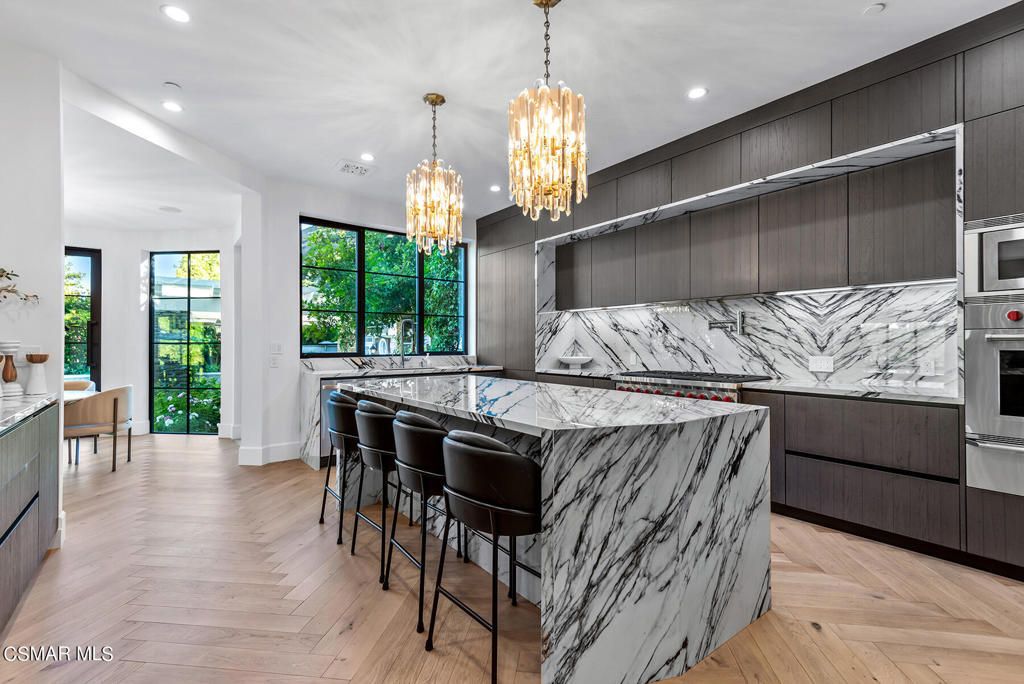 Chandelier, Interior, Kitchen, Marble Walls, Recessed Lighting, Stainless Steel Appliances, Wood Texture Flooring
