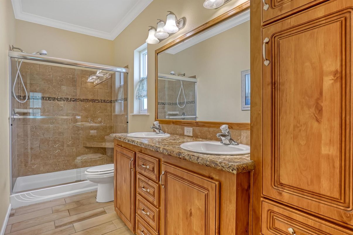 Bathroom, Dual Sink Vanities, Glass Shower, Interior, Wood Texture Flooring