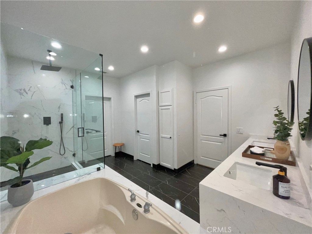 Bathroom, Dual Sink Vanities, Glass Shower, Interior, Marble, Marble Walls, Recessed Lighting
