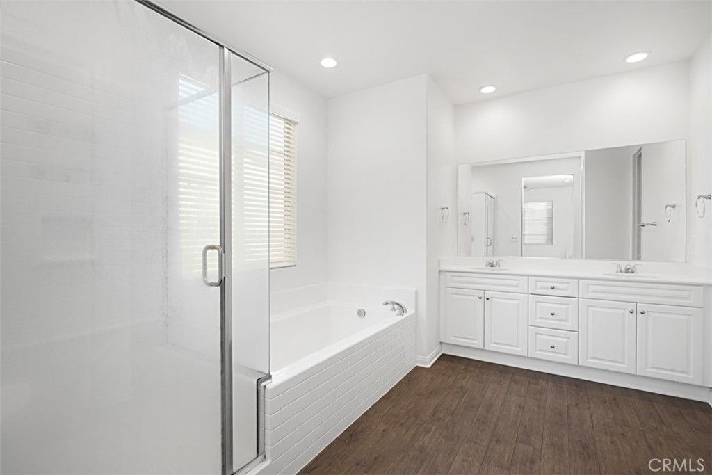 Bathroom, Dual Sink Vanities, Glass Shower, Interior, Recessed Lighting, Wood Texture Flooring