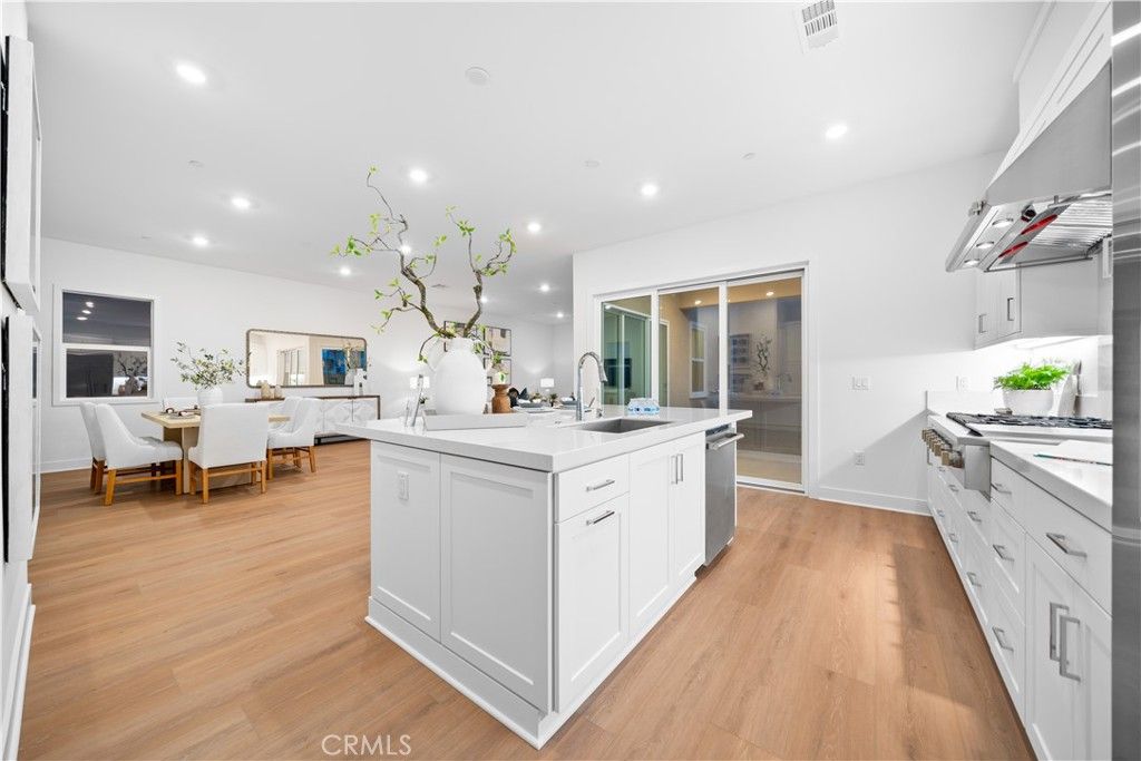 Dining room, Interior, Kitchen, Recessed Lighting, Stainless Steel Appliances, Wood Texture Flooring