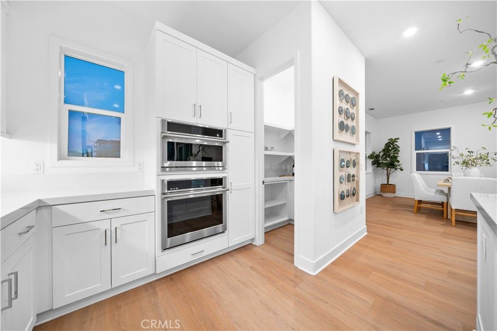 Dining room, Interior, Kitchen, Recessed Lighting, Stainless Steel Appliances, Wood Texture Flooring