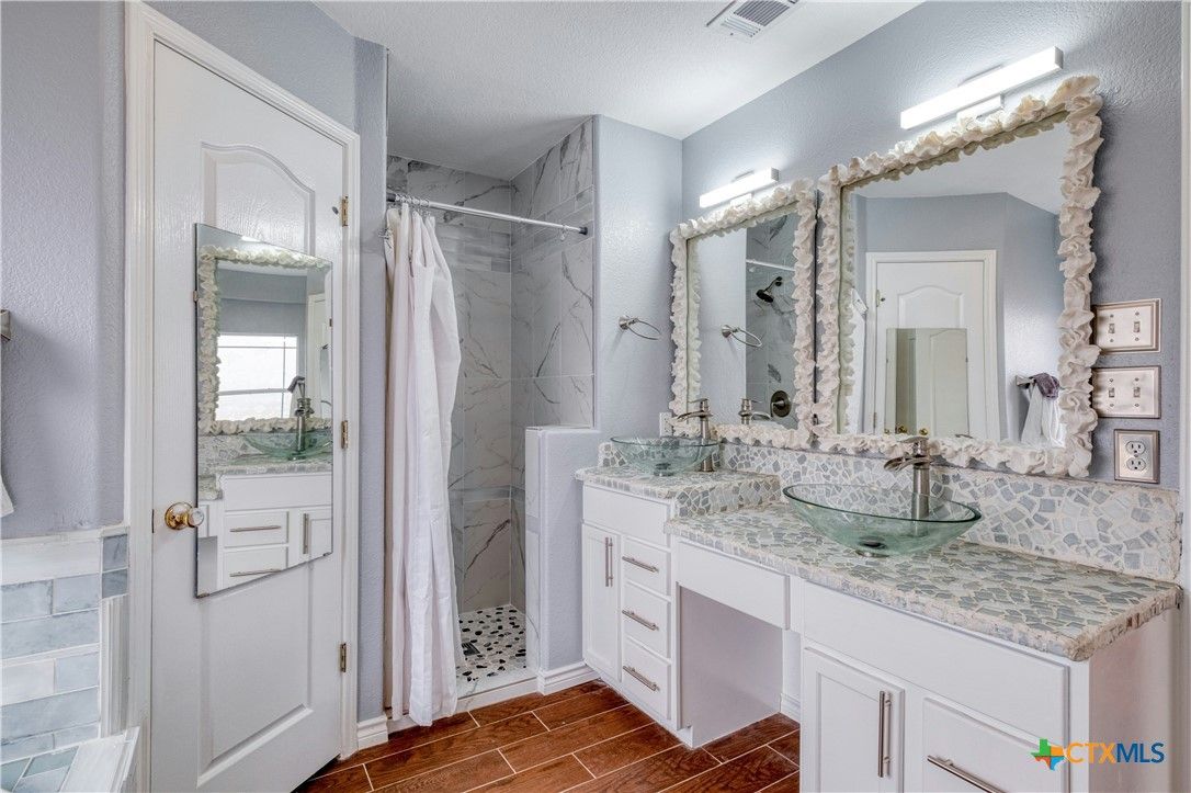Bathroom, Dual Sink Vanities, Interior, Marble Walls, Wood Texture Flooring
