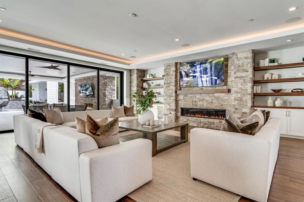 Dining room, Fireplace, Interior, Living room, Recessed Lighting, Stone Walls, Wood Texture Flooring