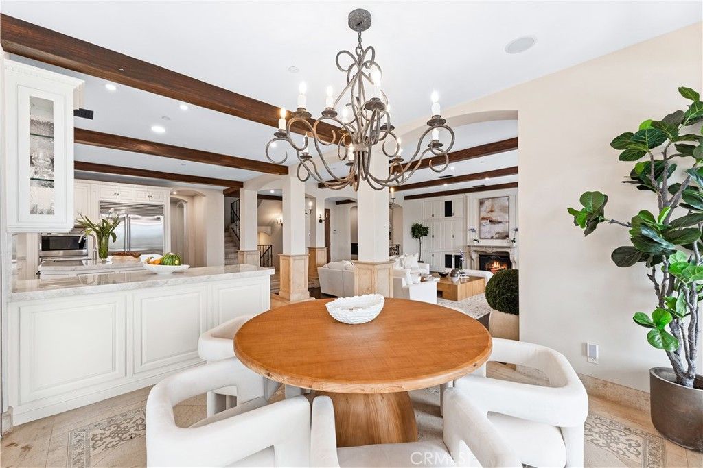 Chandelier, Dining room, Fireplace, Interior, Kitchen, Recessed Lighting, Stainless Steel Appliances, Wooden Beams, Wood Texture Flooring