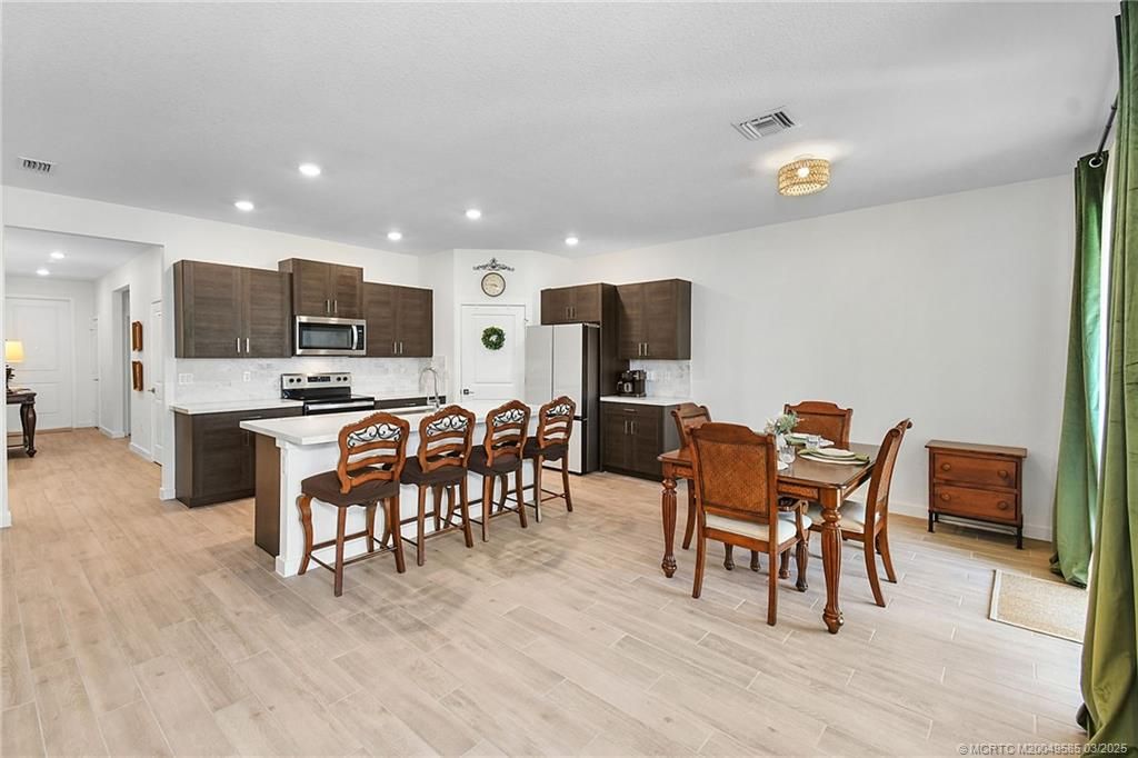 Dining room, Interior, Kitchen, Recessed Lighting, Stainless Steel Appliances, Wood Texture Flooring