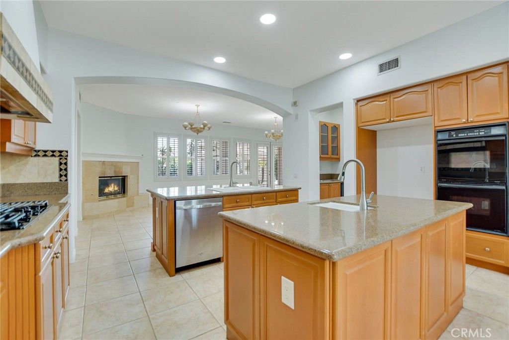 Chandelier, Fireplace, Interior, Kitchen, Recessed Lighting, Stainless Steel Appliances
