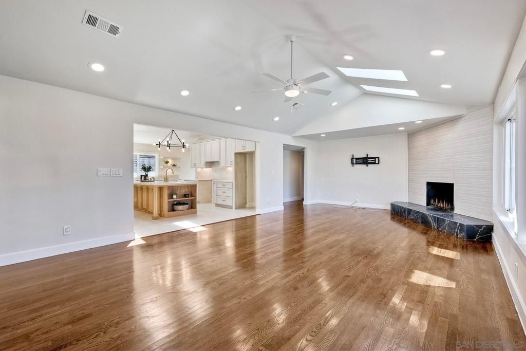 Empty room, Fireplace, Interior, Kitchen, Pendant Lights, Recessed Lighting, Wood Texture Flooring