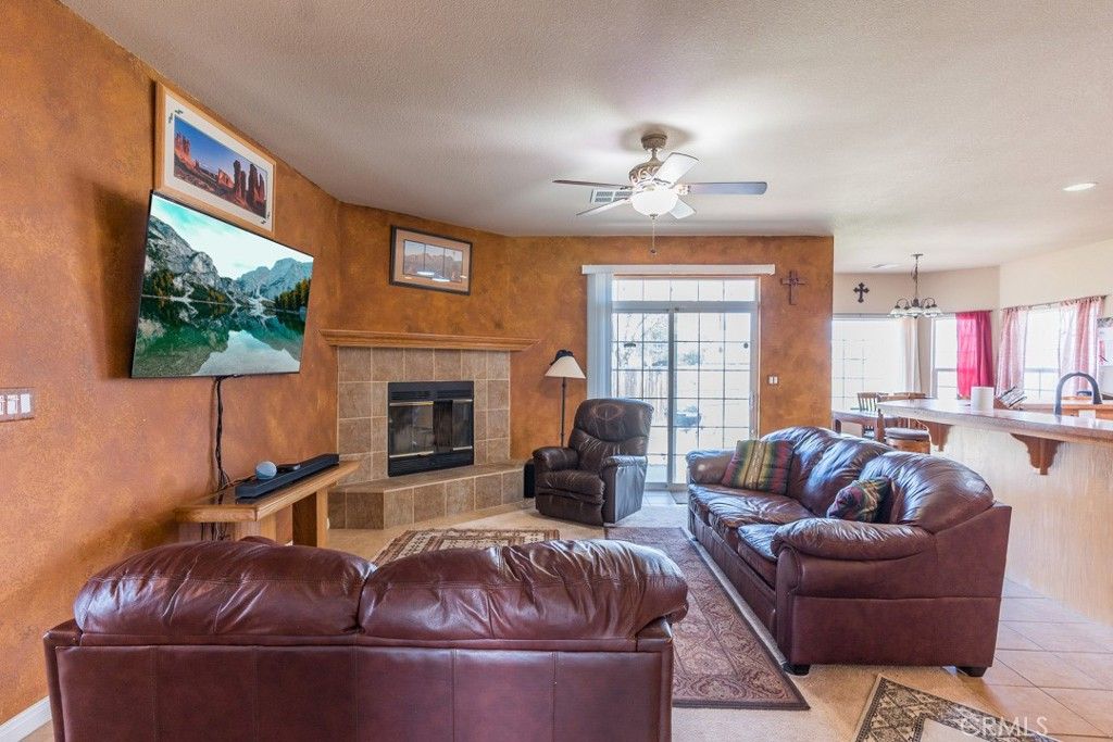 Chandelier, Dining room, Fireplace, Interior, Living room, Pendant Lights, Recessed Lighting, Wooden Walls