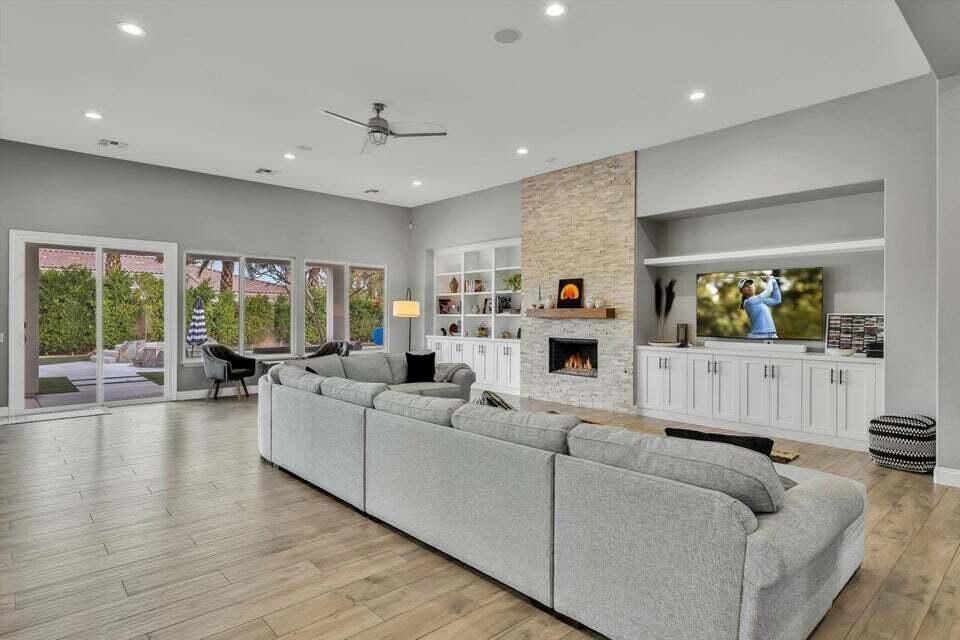 Fireplace, Interior, Living room, Recessed Lighting, Stone Walls, Wood Texture Flooring